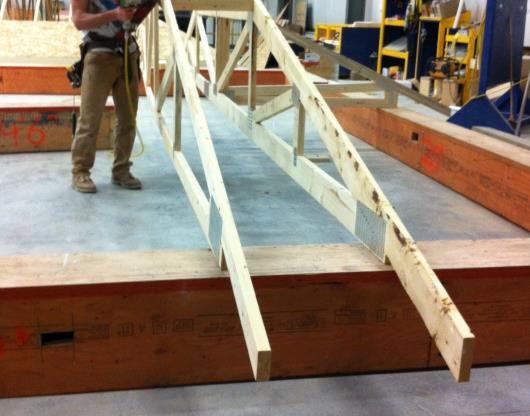 stable and rigid when set in place, and can be set at a comfortable height for framing; with this improvement, several corner sections could be fabricated, and set for