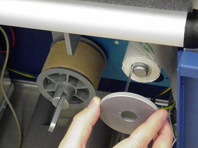Replacing a roll of tags At the end of a roll, the tag dispenser motor will stop