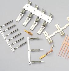 In this way stamped and bent parts made of metal strips and wires are produced, both as single