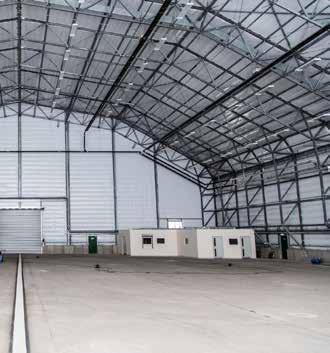 A door measuring 141 ft wide x 46 ft at its highest point provides access to the hangar.