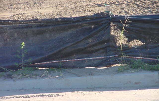 Silt fence is a temporary sediment barrier constructed of woven fabric stretched across supporting posts.