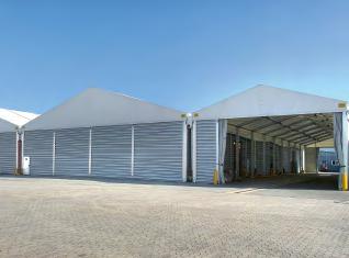Company The side walls can be designed with tarpaulins, trapezoidal sheet metal or insulating sandwich panels.