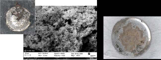 a.) b.) c.) Figure 2 Pictures of a.) failed switch center terminal, b.) SEM micrograph of corrosion products and c.) backside dome showing corrosion of the silver layer.