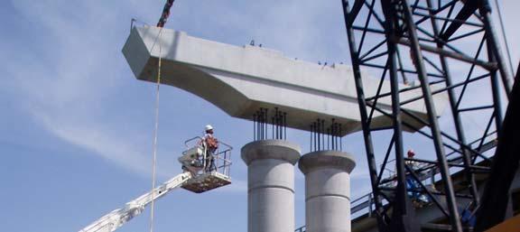 Figure 3, Precast cap installation, Lake Belton Bridge PREFABRICATED SUPERSTRUCTURES A variety of prefabricated superstructure concepts, including prefabricated beams