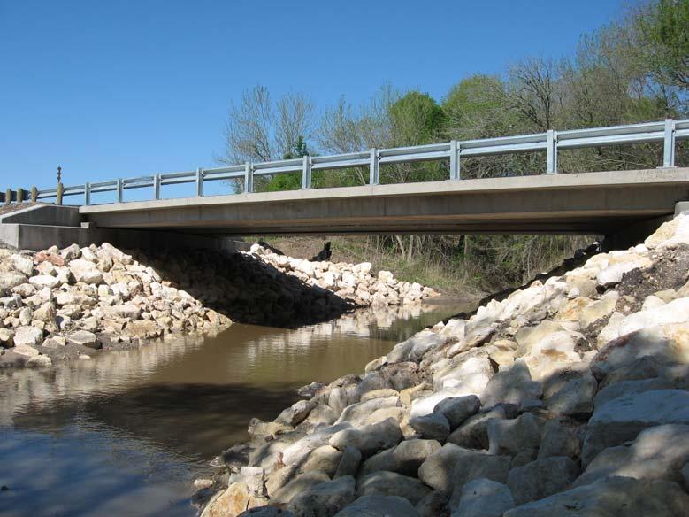 (Jones, 2001) on lateral connections for double tee bridges, which developed simplified connection methods. TxDOT also developed a new beam section for rapid bridge replacement.