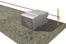 step the base When the grade in front of the wall slopes up or down, the base must be stepped to compensate.