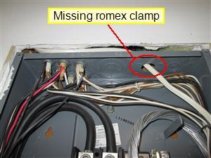 Recommend evaluation and correction by licensed electrical contractor. Missing anti-strain device (Romex clamp / bushing) at wire entrance into the top of the main electrical panel box.