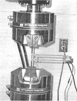 Figure 3.3 Machine used to perform steel coupon testing (Miller 2006) 3.3.3 Steel Tubes The steel tubes were tested in the same manner as the rebar.
