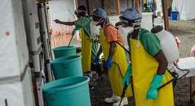SWIM Solution - Chlorine Kills Ebola Workers wait