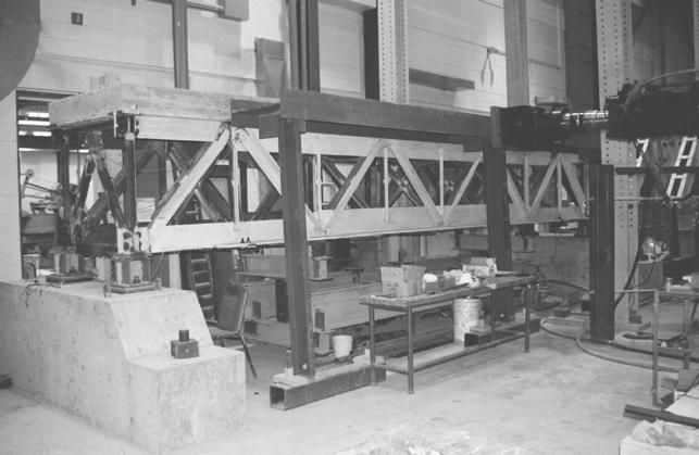 TESTING STEEL DUCTILE RETROFITS A 27-ft span steel deck-truss model was designed and constructed in the structures laboratory of the University of the Ottawa.