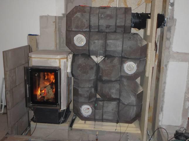 Tiled Stove (Log Wood) + Heat Pump Ortner / BIOENERGY 2020+ - close to market Tiled stove manufactured