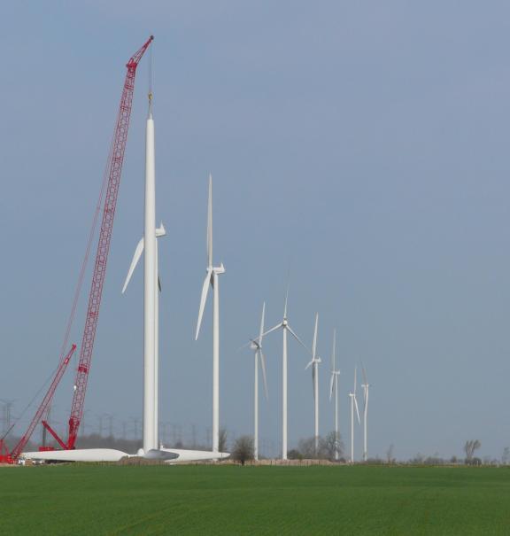The wind turbines are located approximately a few hundred metres apart, such that each wind farm project site covers a large area of up to about 10 km by 10 km.