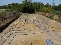 The trench can be dug with a conventional digger rather than a specialised drilling rig, so its cost is significantly cheaper than a borehole. Coiled (Slinky).