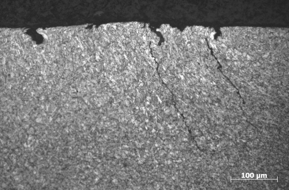 Improper heat treatment Figure 8 Photomicrograph of cracks initiating at pits in a cold-worked layer on the surface of a Grade P110 coupling.