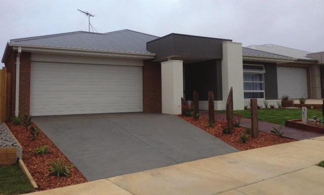 Plain (uncoloured) concrete driveways are not permitted 2 The driveway must be setback from the closest side boundary by at least 400mm to allow for landscaping strip.