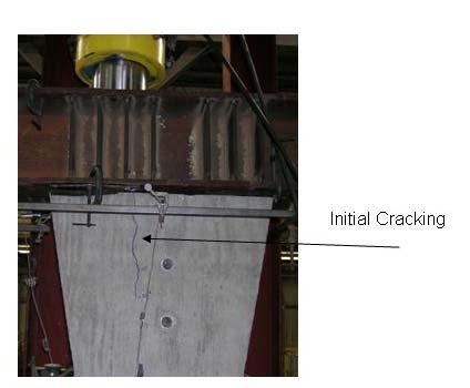 The failure was a brittle type failure. When the load reached approximately 66 percent of the ultimate load, large cracks began to form as shown in Figure 5.4.