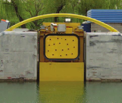 The yellow boom lays out a three-inch diameter steel cable that can stop a ship in the event that it is unable to on its own. function.