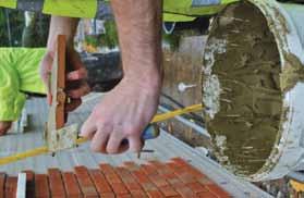 Apply pointing mortar using a pointing gun and smooth out