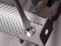 Gypframe MF8 Strap Hanger is secured to Gypframe MF Soffit Cleats with Gypframe MF Nuts and Bolts
