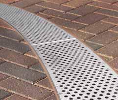 'Streamline' gratings are secured in the channel leaving a peripheral slot 8mm wide. 176 8 8 Peripheral slot helps prevent water bridging the grating.
