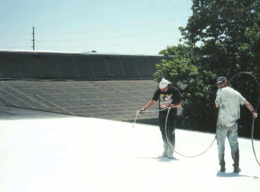 Acrylic coatings such as the one being sprayed on here can help extend the life of an old EPDM roof system (Photo courtesy of United Coatings.