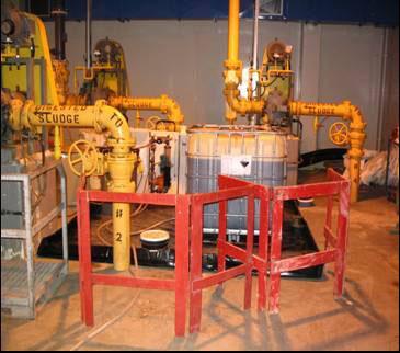 around the dosing pump skid and tote. Figure 2 illustrates the arrangement of the secondary containment system and the chemical tote.