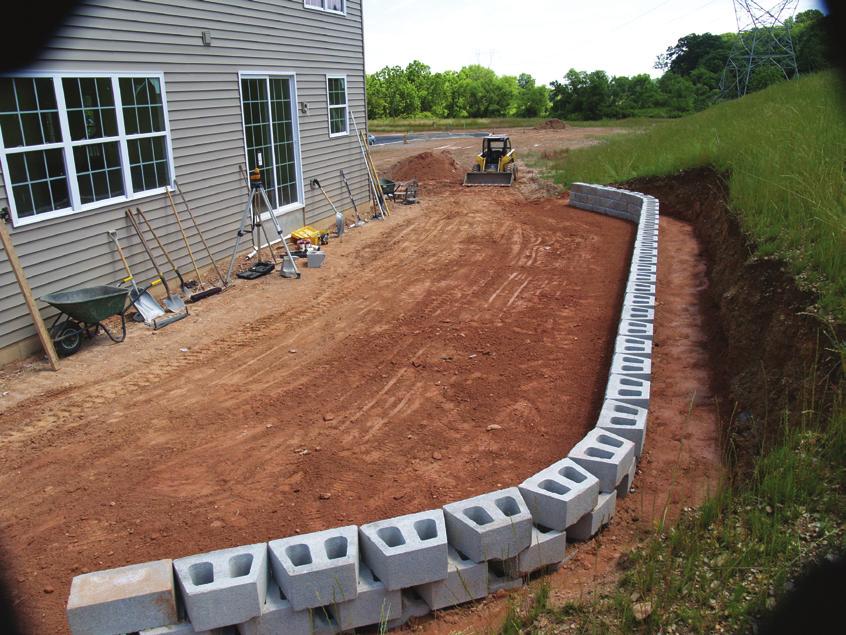 Mark the location of the excavation trench so that, when dug, it is wide enough to accommodate the wall block and leveling pad and complies with drawings and specifications.