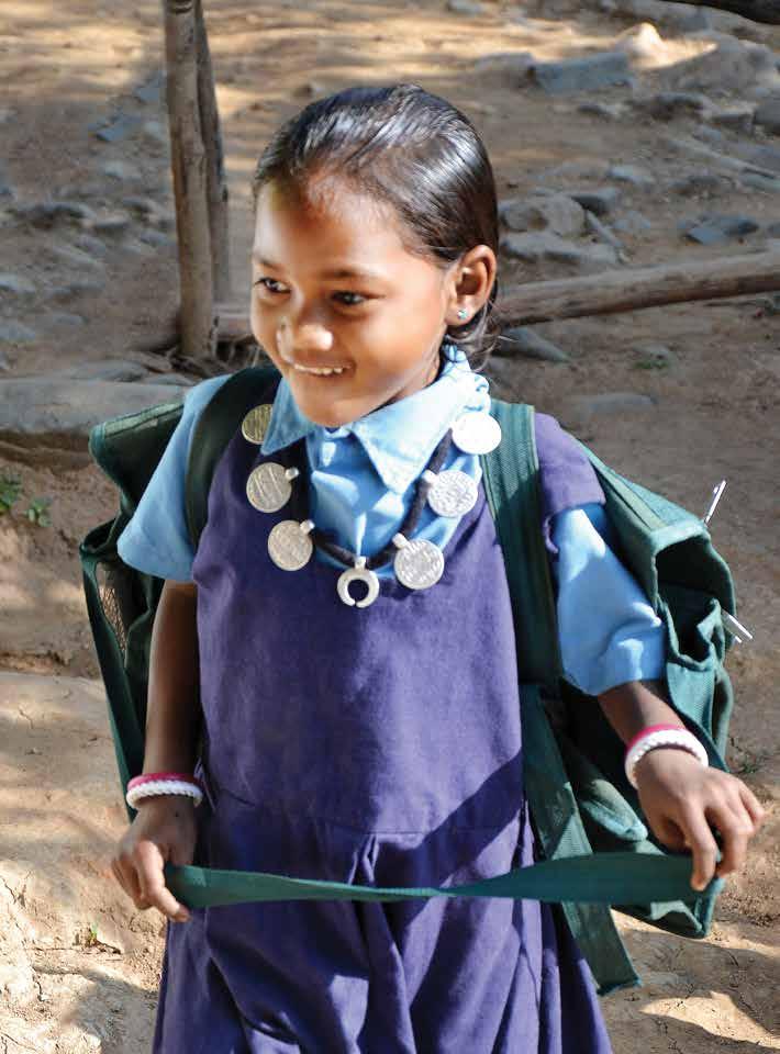 A Baiga tribal girl enthusiastically attending