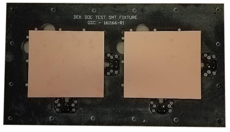 Figure 4: SMT Carrier Fixture. Figure 2. Test Stencil. The coupon used for SEM photographs is also shown below (Figure 3). Table 1: Solder Paste Printer Parameters.