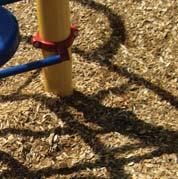 Examples of accessible playspace ground surfaces. From left to right: poured-in-place rubber, engineered wood fibre and shredded rubber.