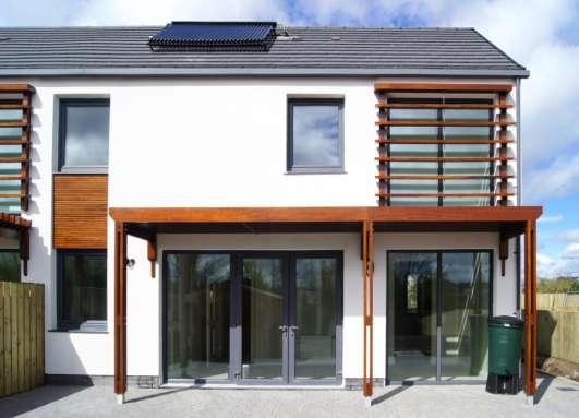 Access from the dwellings to the rear south facing patio area and rear enclosed gardens is via triple glazed doors with sun shading brise soleil to the large south facing glazing.