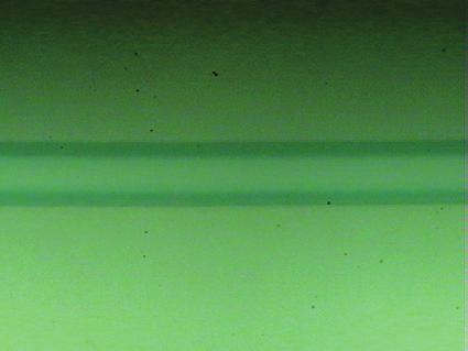is retained on the glass substrate. This means that the irradiated laser energy is sufficient to crystallize the a-ito thin film, and the irradiated a-ito is completely transformed into c-ito.