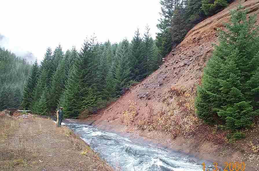 Monitor slopes above canal to observe erosion pattern and evaluate if