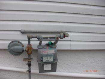 319 YZ street, Anytown, New York 9. Main Gas Valve Condition Materials: north side Meter located at exterior. All gas appliances have cut-off valves in line at each unit. No gas odors detected. 10.