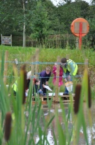 and education programme c) Wildlife Trust volunteers carrying out