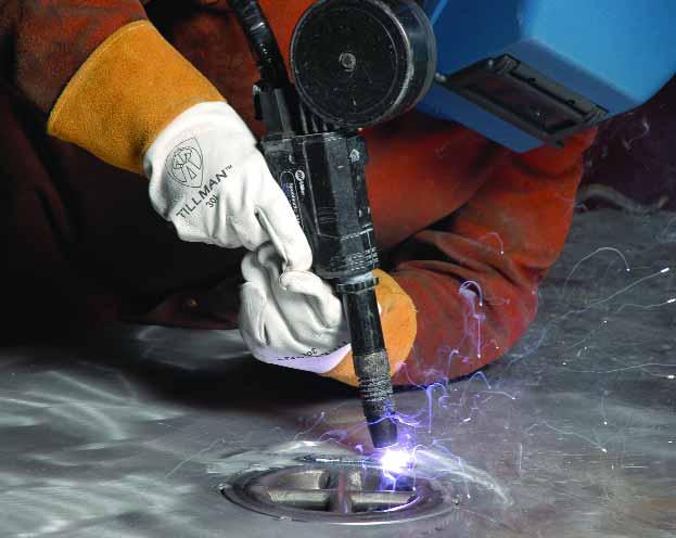 What You Can Do with Explosion We l d i n g BY DAVID CUTTER Lead Arc welding of a forged steel cup-and-cross tiedown assembly into an aluminum aircraft carrier deck plate.