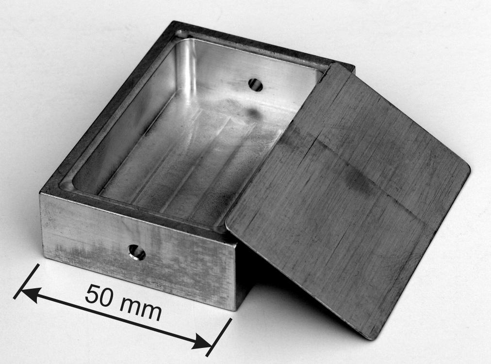 WELDING RESERCH Fig. 1 Example of an electronic package consisting of a 6061-T6 aluminum machined box and 4047 aluminum sheet lid.
