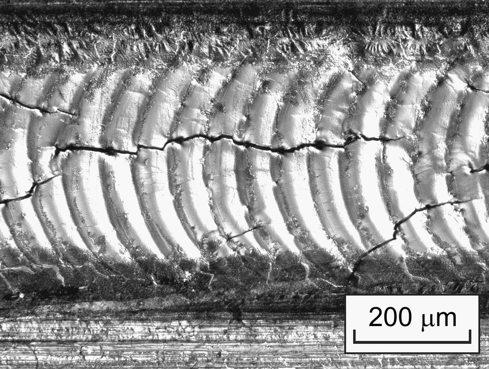Solidification cracking will occur when tensile thermomechanical strains in the material due to thermal contraction of the recently solidified metal causes adjacent dendrites or cellular-dendrites to