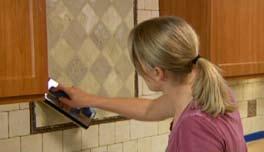 Use a rubber grout float to apply your grout. Make sure to press the grout into all joints using several sweeps.