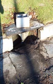 Determine the length of a 15 cm (6 inch) high curb inlet that is required to remove all the water from the gutter. Inlet Depression Width of 0.