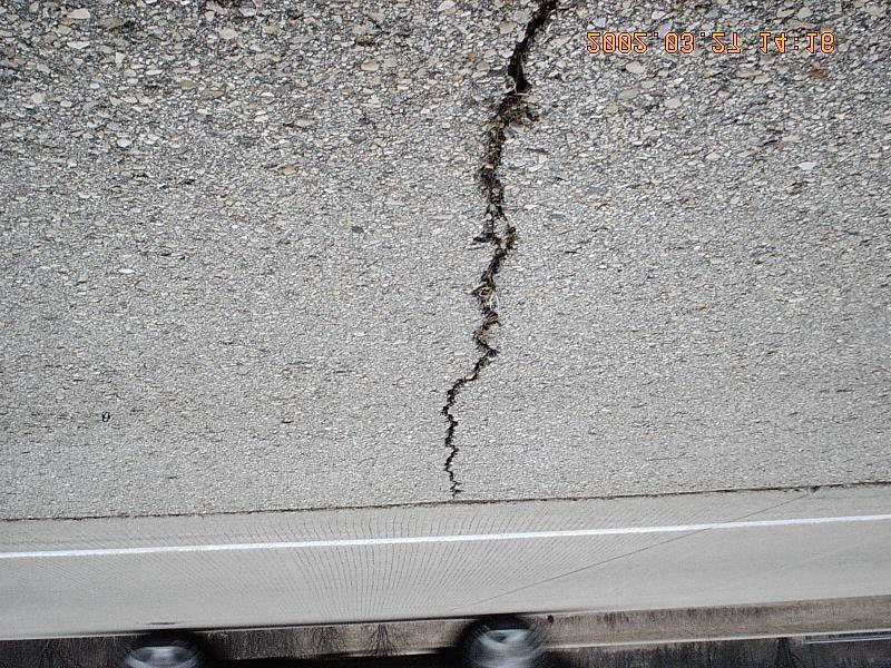 Table 2: Measurement Description of Transverse Cracking on Asphalt Shoulders SEVERITY 0 = None; 1 = less than 13-mm (1/2-inch) in width 2 = greater than 13-mm (1/2-inch) in width 3 = band cracking.