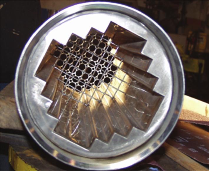 Science and Technology of Nuclear Installations 5 Figure 6: Photo of core shroud showing lower core flow plate behind the core grid wires [12].