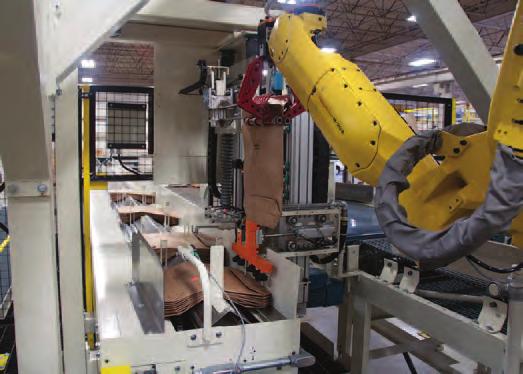 Mollers Robotic Valve Bag Placer automatically places paper or plastic valve bags on up to 4 in-line spouts at a maximum rate of 1200 to 1500 bags per hour.