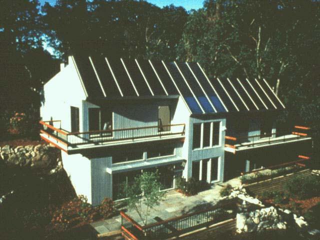 This home in Brookline, Mass collects heat through southern windows and
