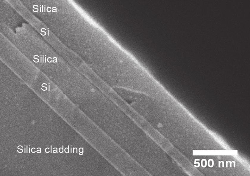 Figure 10: SEM image showing a four layered fiber. The silica has been partially etched out with hydrofluoric acid to show the contrast in heights between the layers 4.