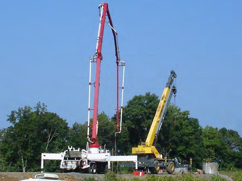 truck and crane is presented in Figure 3.15. The end of the pump line was attached to an 8 in. diameter, straight steel pipe, which served as the tremie for these experimental shafts.