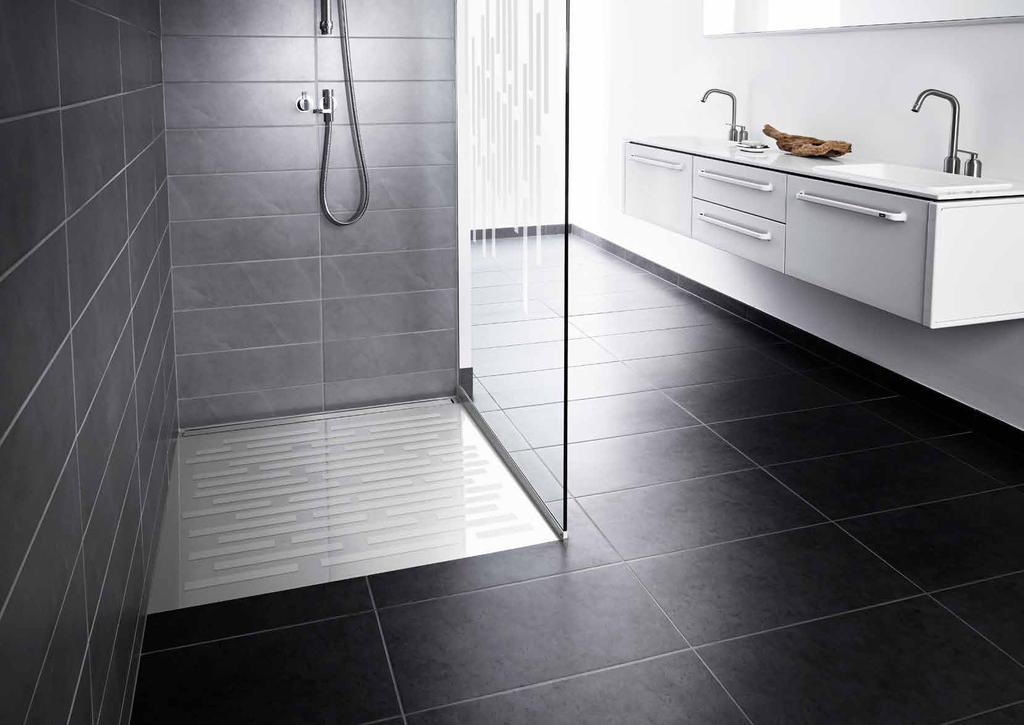 GLASSLINE SHOWER BASE unidrain s latest addition to the exclusive GlassLine series is a shower base made of glass and stainless steel.