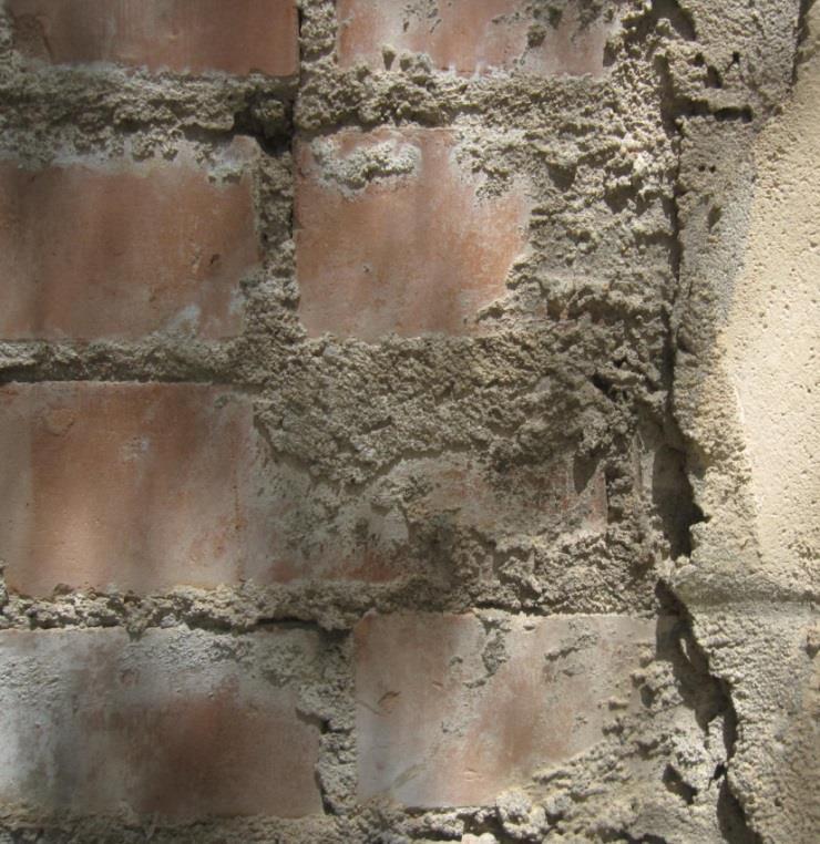 The walls are typically built with individual brick units sitting in a mortar bed. We observed the walls are constructed with a small gap in the mortar layer between the brick units.