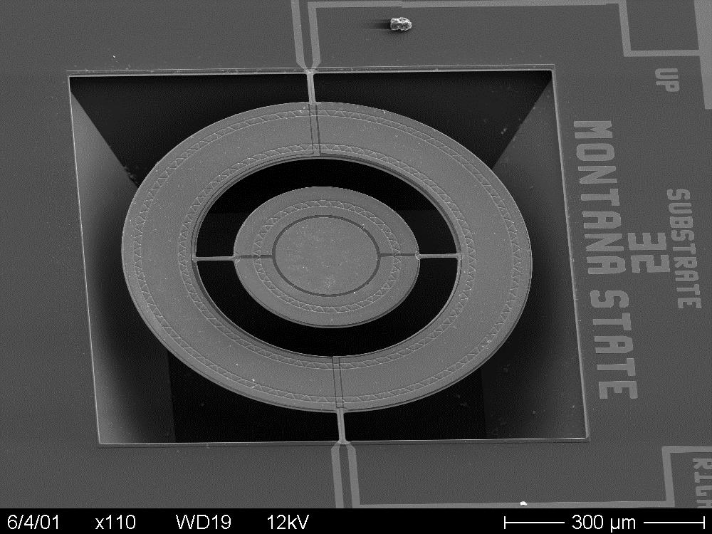 Thirty-two different biaxial mirror designs and numerous test structures are produced on a die with 34 die on a four-inch wafer.