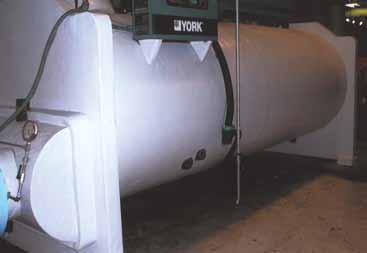 The above application shows a chiller that was insulated in a mechanical room with rubber insulation and covered with VentureClad 1577CW-WM.